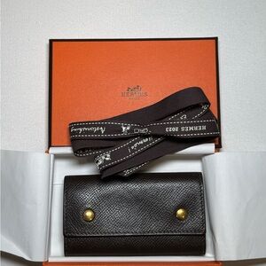 Hermes Black Leather Wallet with Gold Accents